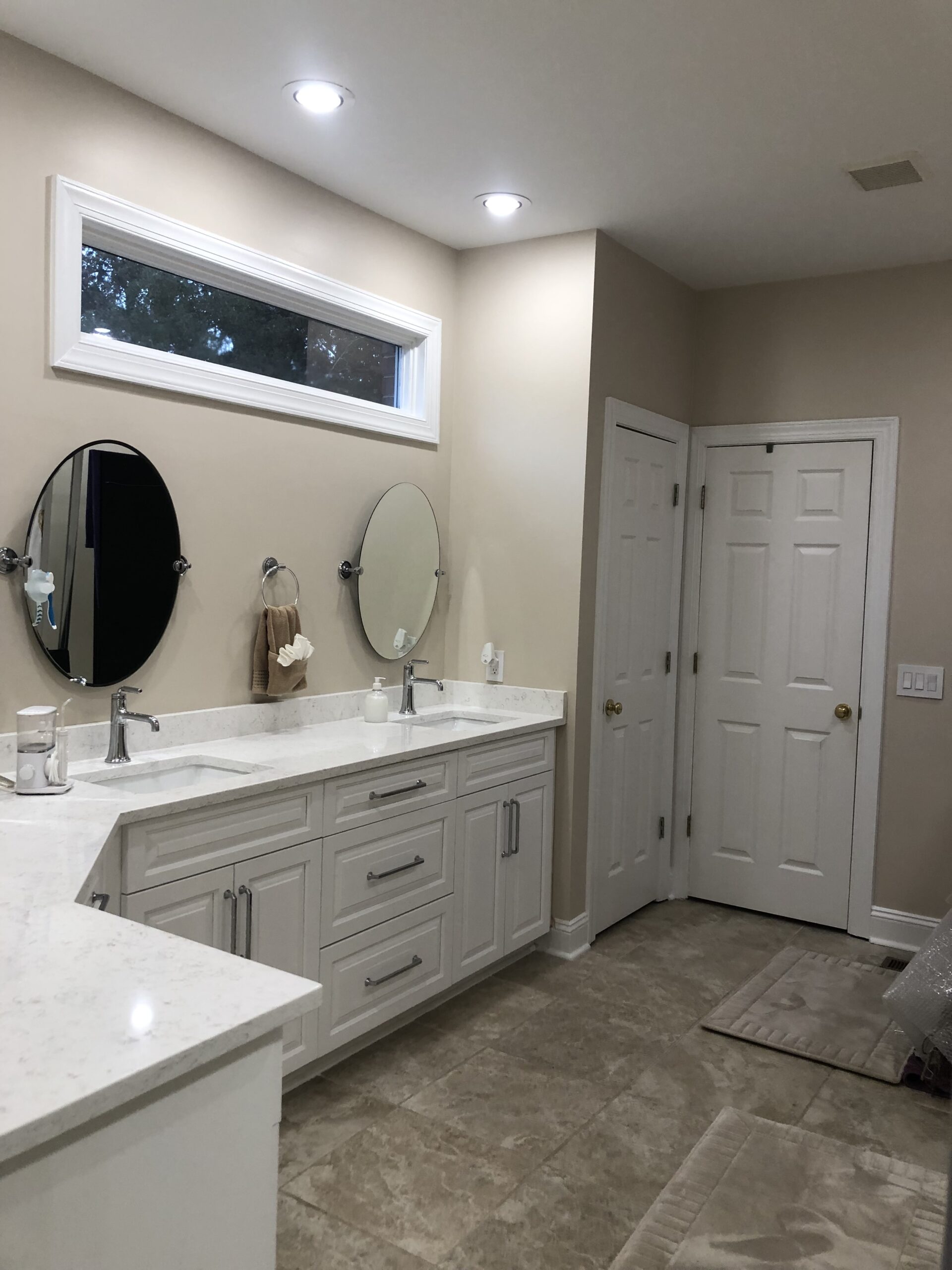 Bathroom with two mirrors painted.